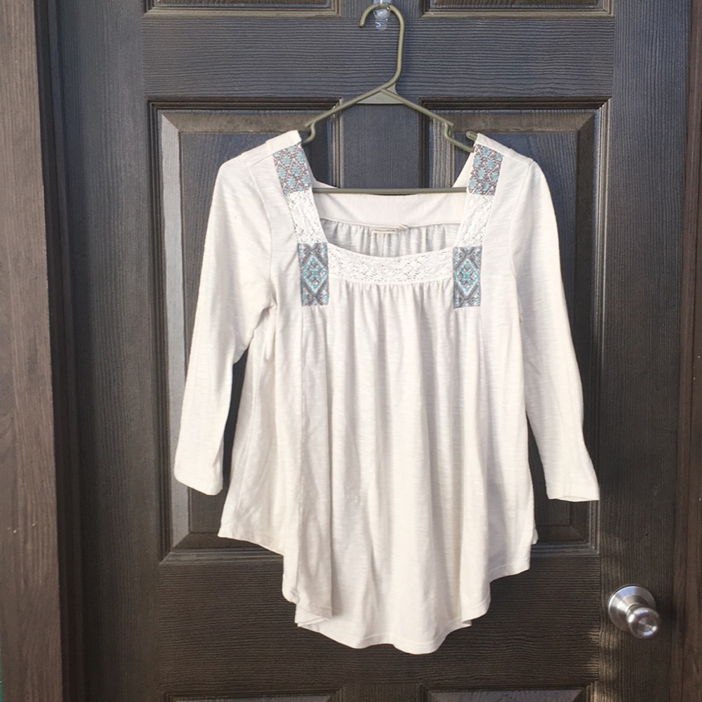 Mudd top with embroidery and crochet trim.